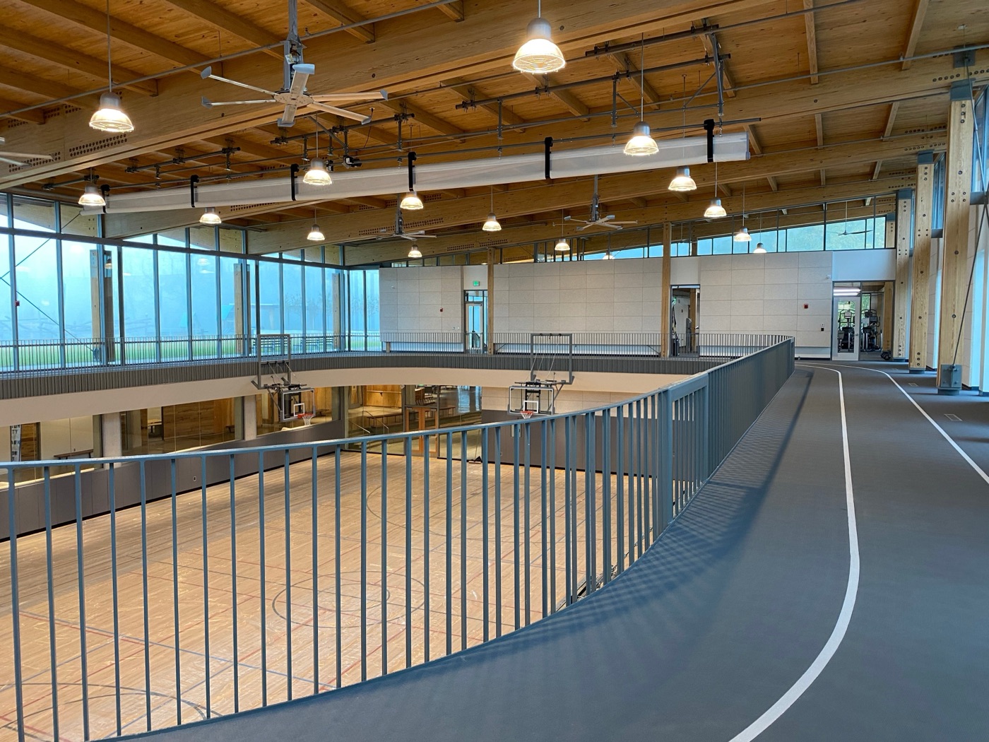 Steel guardrail around the indoor running track at Lubber Run Community Center