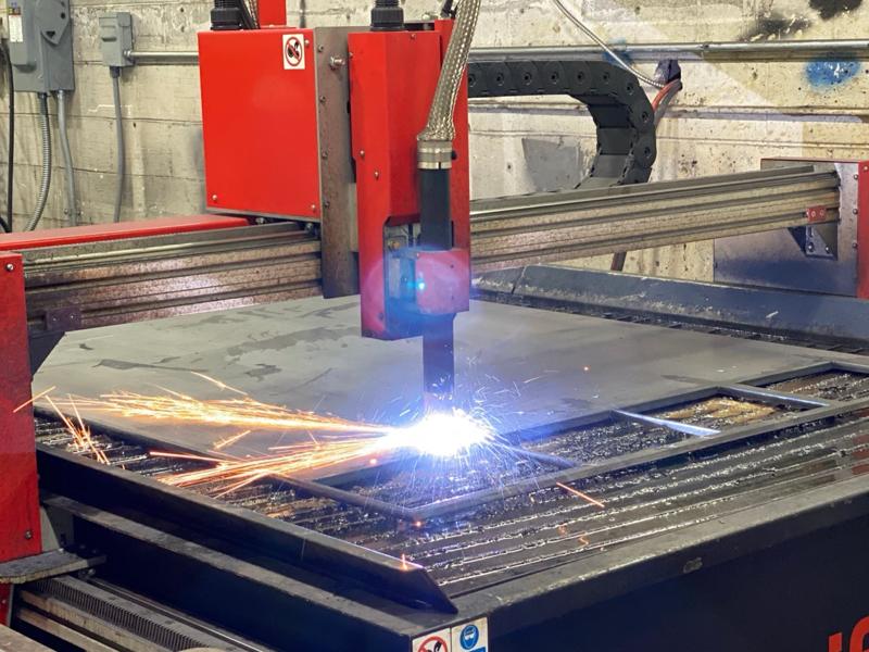 CNC plasma table cutting steel plate